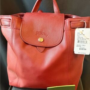Longchamp Le Pliage canvas w/leather backpack. BNWT and dust bag.  Never used.